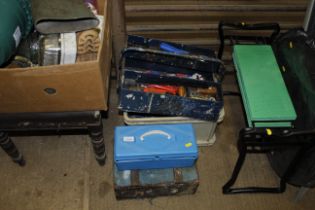 A collection of tool boxes and contents of tools