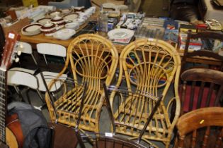 A pair of cane elbow chairs