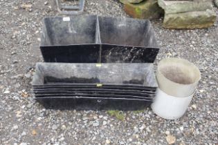 A collection of fibre glass planters