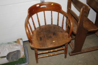 An early 20th Century tub shaped desk chair