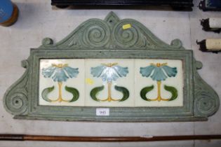 A Victorian cast iron plaque inset with three Art