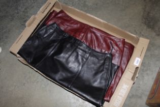 Three leather skirts