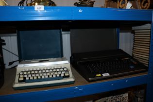 A Panasonic typewriter and an Imperial portable typewriter