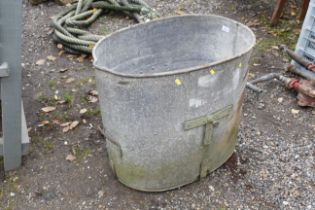 A galvanised water carrier