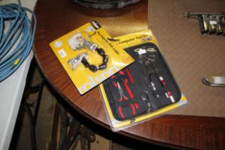A 9 piece computer tool kit and a flexi magnifier