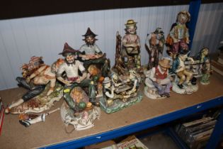 A collection of Capo di Monte figure groups, some damaged