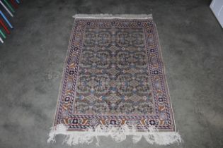 An approx. 4'4" x 3" Persian patterned rug