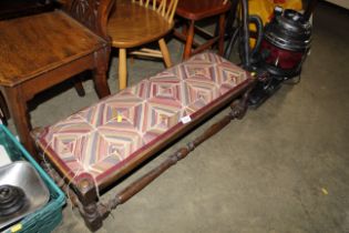 A 1930's long upholstered stool