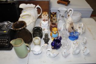 A quantity of various pottery jugs, glass and chin