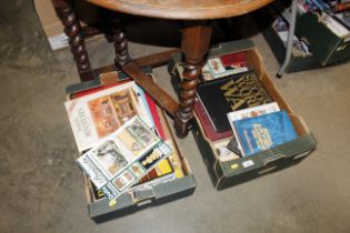 Two boxes of books including war related; doll's h