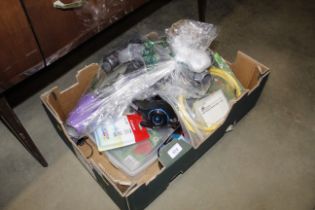 A box of miscellaneous domestic items including Dy