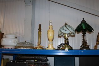 Four various table lamps; a ceiling light and a gl