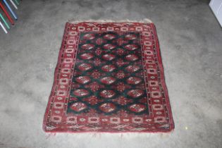 An approx. 4" x 3'3" red Baccara patterned rug