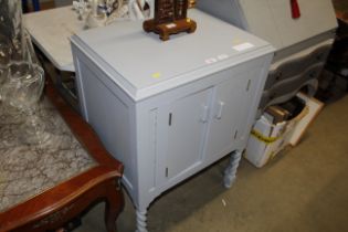 A grey painted side cupboard