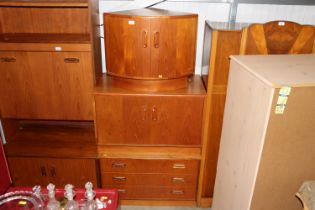 A G-Plan three drawer chest; double cupboard and b