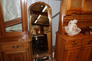 A gilt framed bevel edged wall mirror