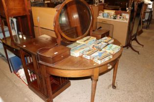 A mahogany demi-lune shaped dressing table with sw