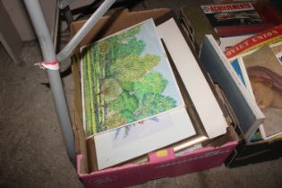 A box of various unframed artwork to include water