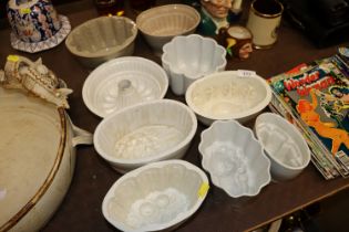 Nine various pottery jelly moulds