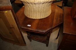 An Edwardian walnut octagonal window table