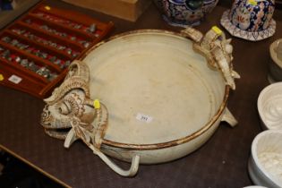 A Studio pottery dish with gargoyle decoration, ma