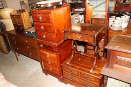 A pair of pine three drawer bedside chests; a chev