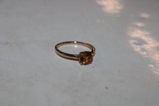 A 9ct gold ring set with citrine coloured stone, a