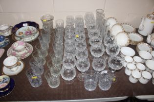 A collection of various cut table glassware