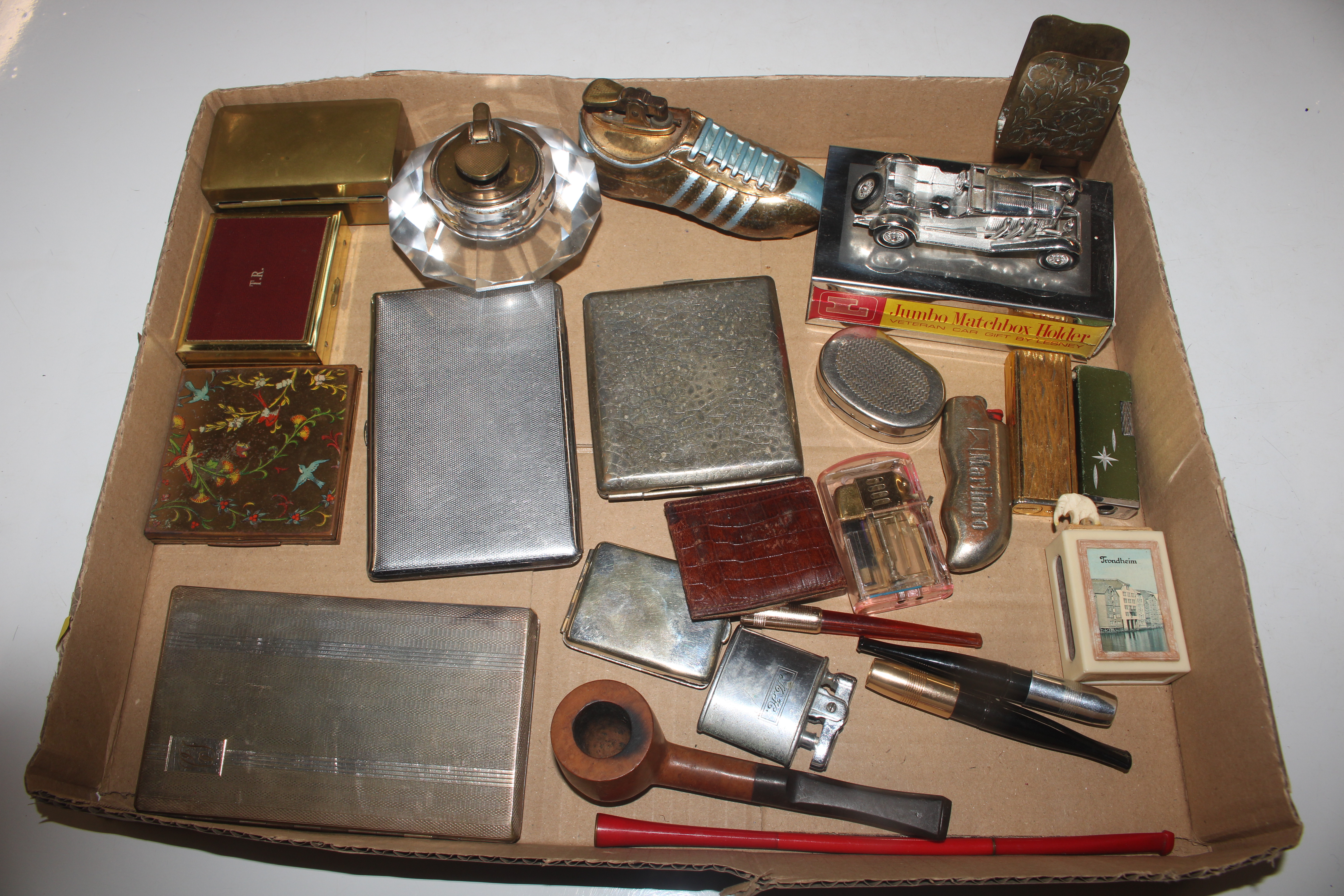 A box of smoking related items to include pipe, ci