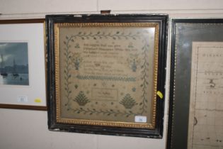 A 19th Century sampler with verse and floral decor
