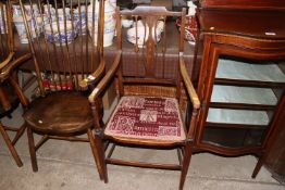 An Edwardian inlaid elbow chair