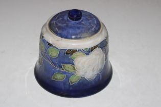 A Doulton pottery jar and cover with leaf decorati