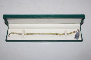 A Sterling silver and opal tennis bracelet, approx