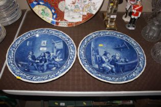 A pair of Delft blue and white chargers decorated
