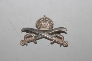 A silver military brooch