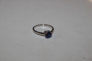 A 9ct white gold ring set with blue coloured stone