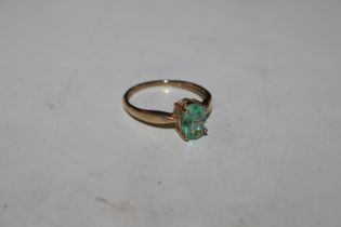 A 9ct gold ring set with coloured stone, approx. t