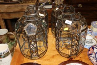 A set of four decorative light shades