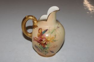 A Royal Worcester ewer with floral decoration on p