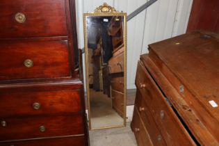 A gilt framed wall mirror with shell decoration