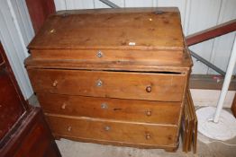 A large antique stripped pine bureau fitted three