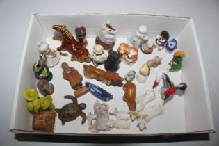 A box containing various miniatures including orna