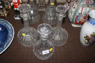 A pair of cut glass decanters and a ring neck cut