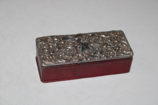 A rectangular leather clad trinket box with emboss