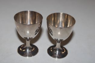 A pair of Victorian silver egg-cups, hallmarked Sh