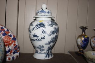 A Chinese blue and white baluster vase and cover w