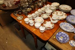 A Victorian walnut drop leaf table