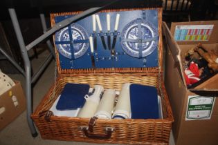 A wicker cased picnic hamper set