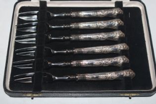 A cased set of six silver handled cake forks, Hall