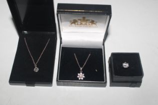 Two 925 silver necklaces each with pendants; and a
